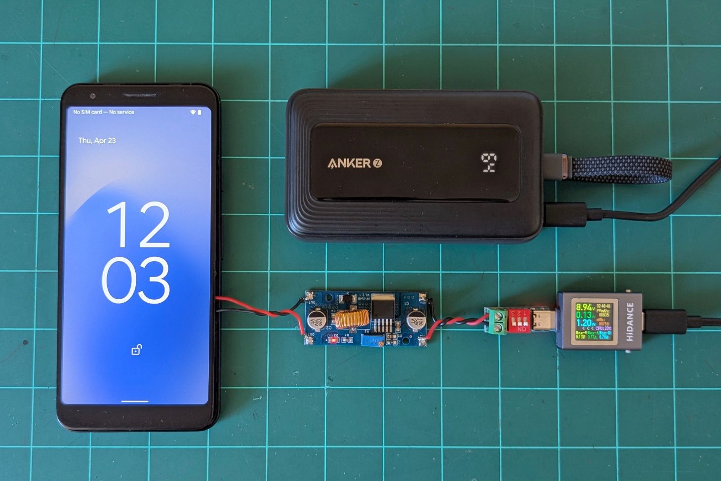 Phone powered from buck converter and power bank.