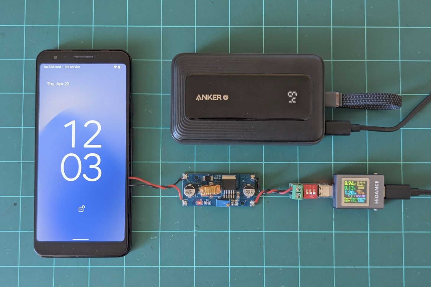 Phone powered from buck converter and power bank.