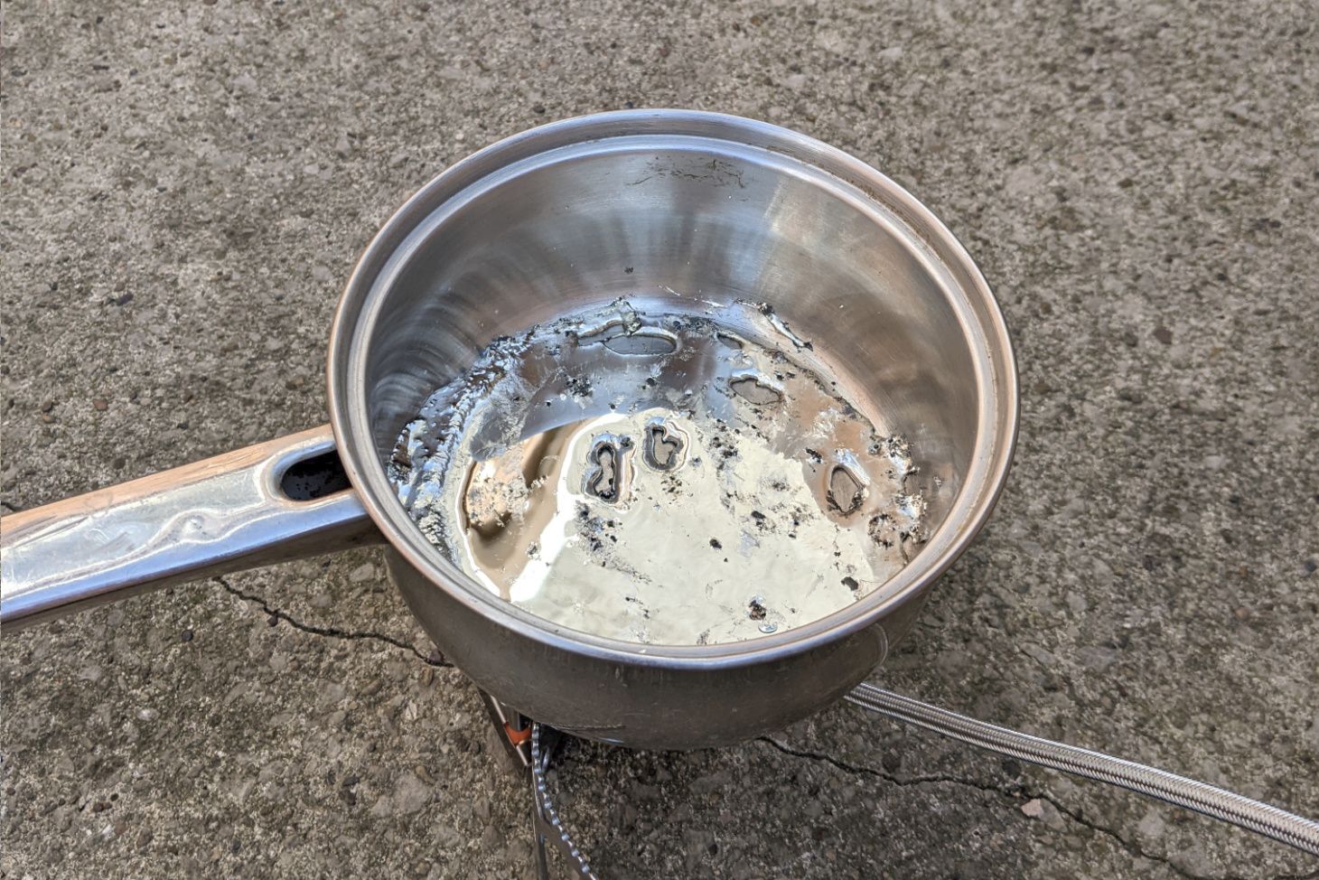 Molten pewter in the saucepan.