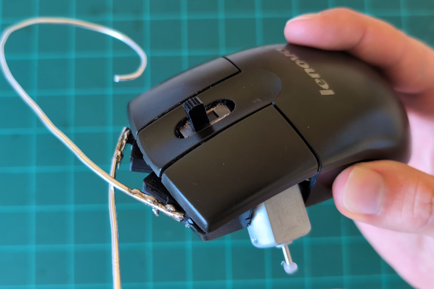 A switch mounted in the hole left by the mousewheel.