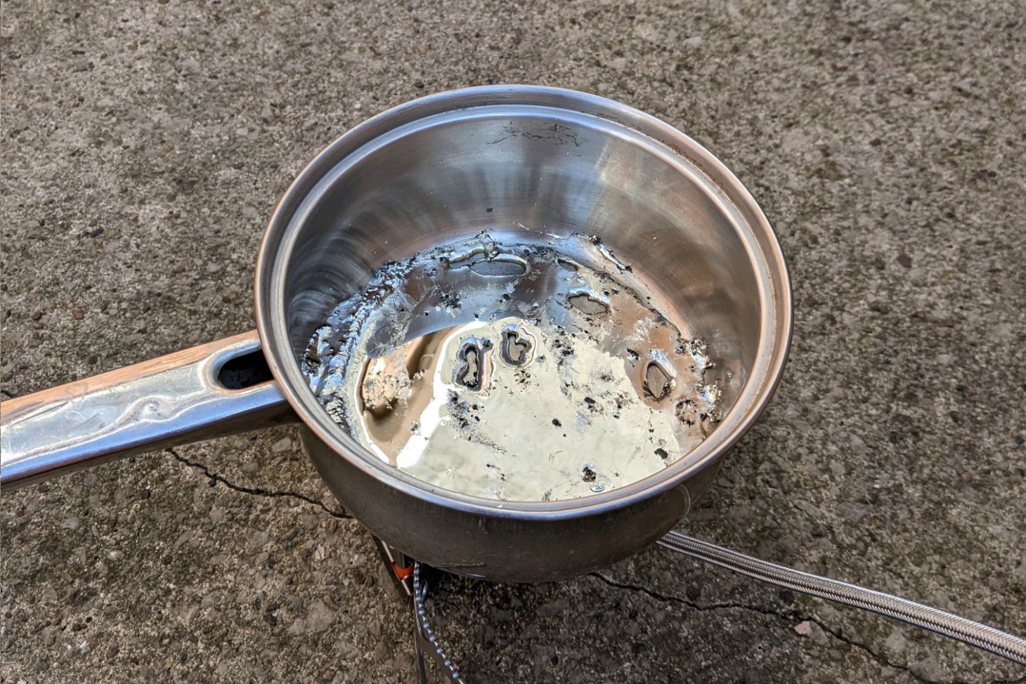 Molten pewter in the saucepan.