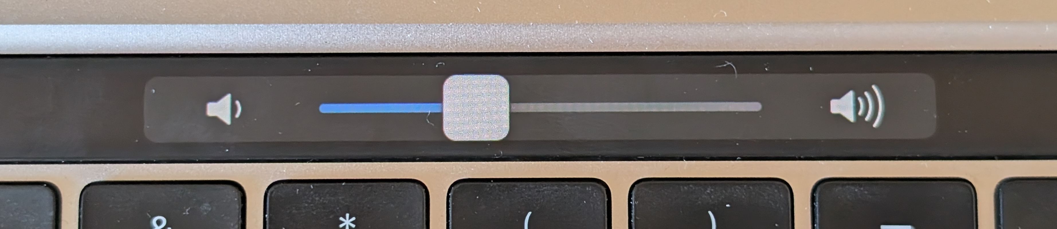 The Touch Bar volume slider in its expanded state.