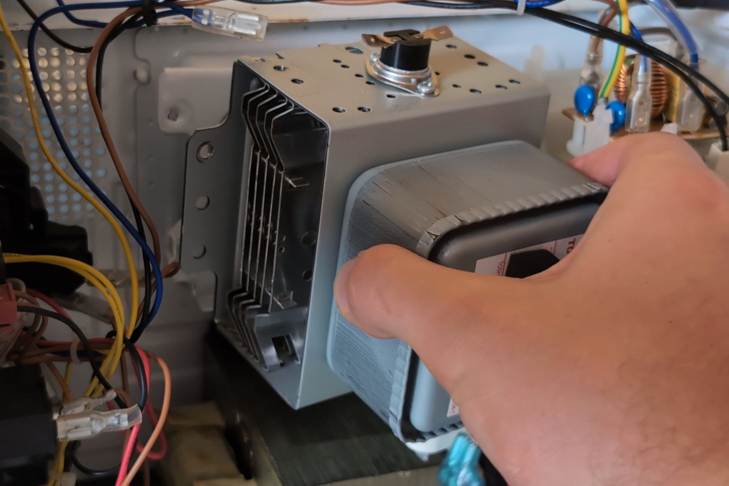 Removing the magnetron.